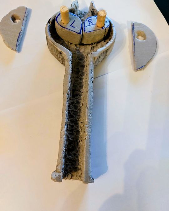 Early hand-carved foam prototype of the Rope Cobra's dual-cam mechanism